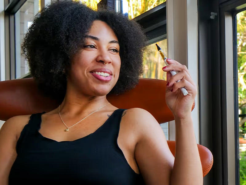 woman with CBD vape for anxiety